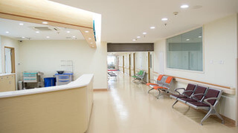 An empty hospital hallway and waiting area