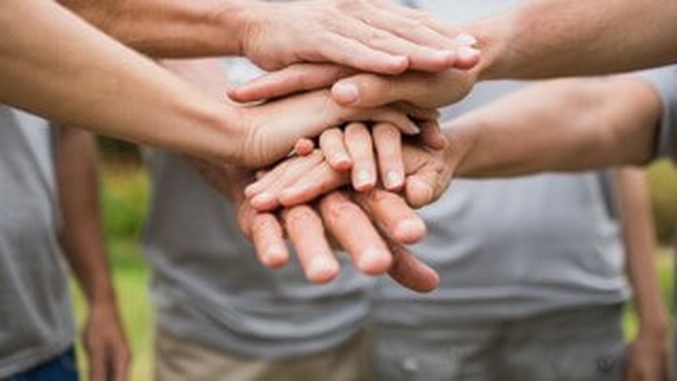 Six different people's hands put together